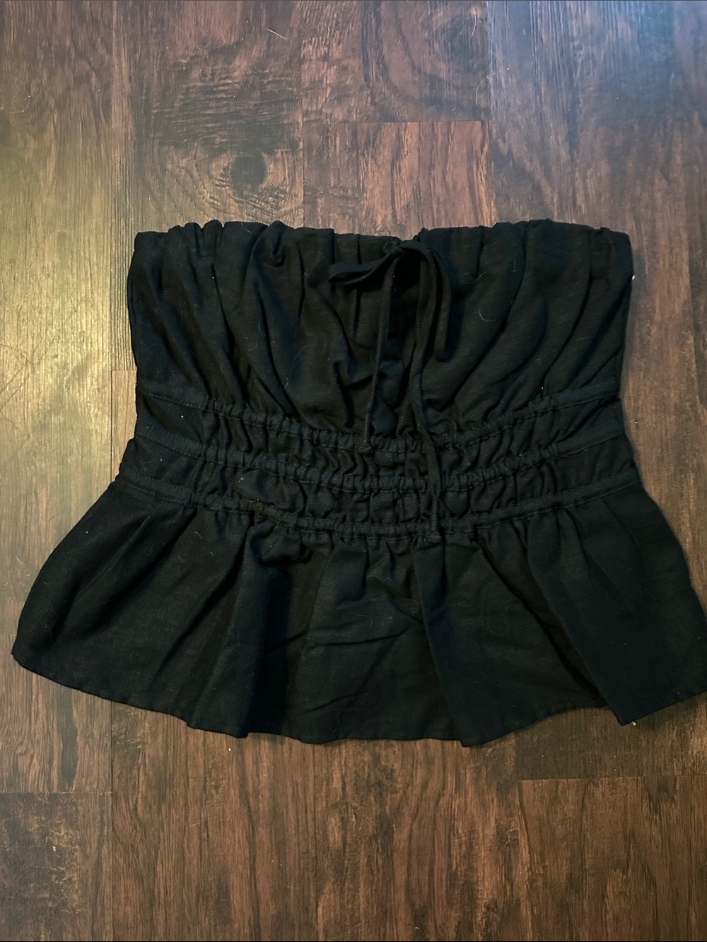 Anthropologie Black Smocked Peplum strapless top M - Women